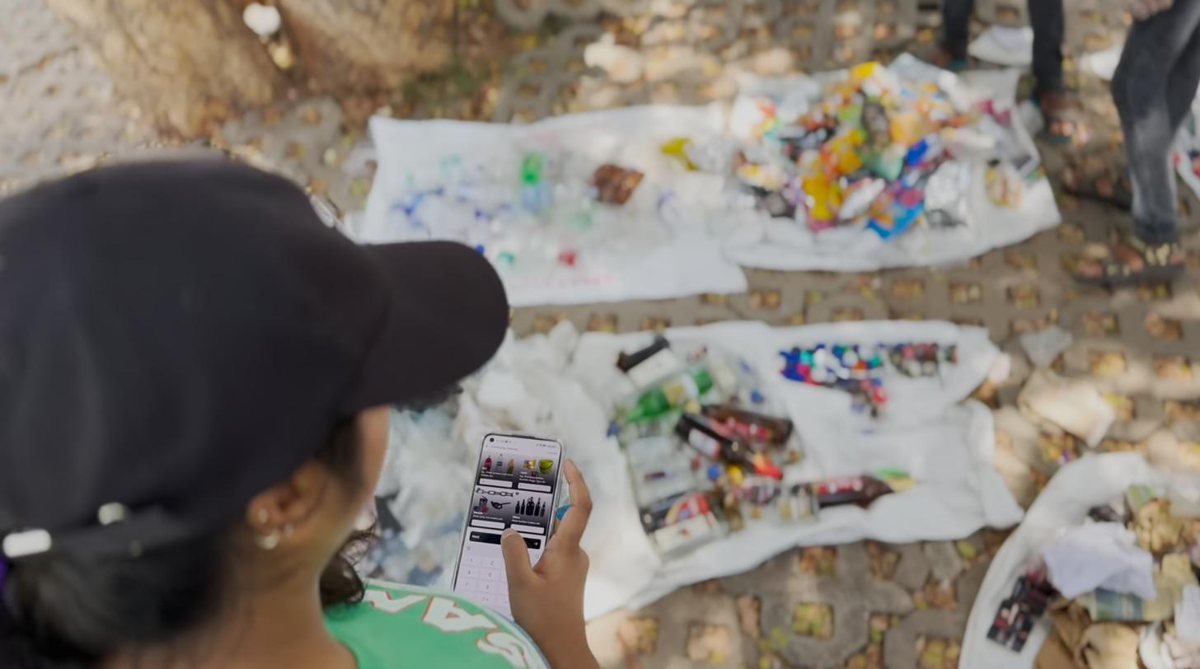 Volunteers running a field waste audit with the Earth5R app